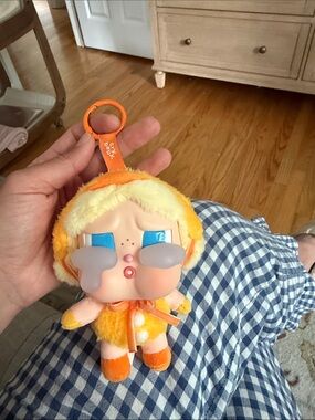 Crying Baby Plush Keychain - Orange Plush with Blue Eyes